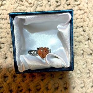 Stone heart ring with heart detail on sides